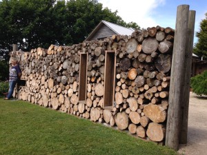 Log wall, The Potager.