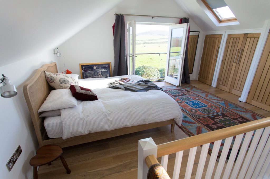 The wonderful bed with views of Chapel Carn Brea.